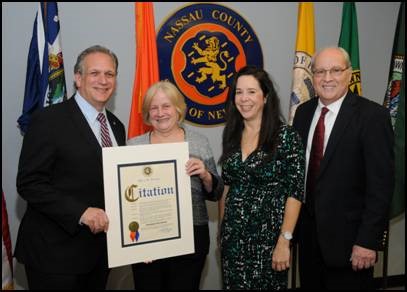 (Left to right) County Executive Ed Mangano, Honoree Deborah De Stefano, Supervisor Jeanne Dhande, and Dr. John Imhof